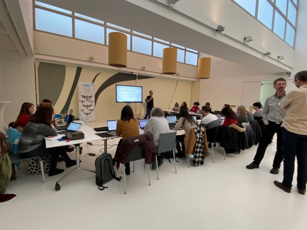 Photo of the group working on their laptops creating the datasets